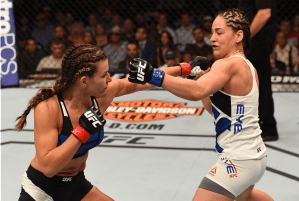 Miesha Tate connects on a punch versus Jessica Eye at UFC on FOX (Photo credit Getty Images via UFC.com)