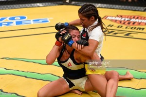 Julianna Peña grapples with Cat Zingano at UFC 200.