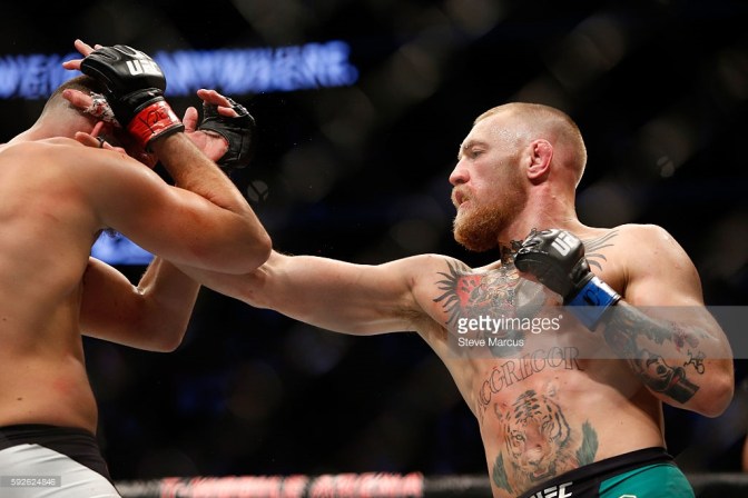 McGregor lands a straight right against Diaz at UFC 202. (Credit: Getty Images)
